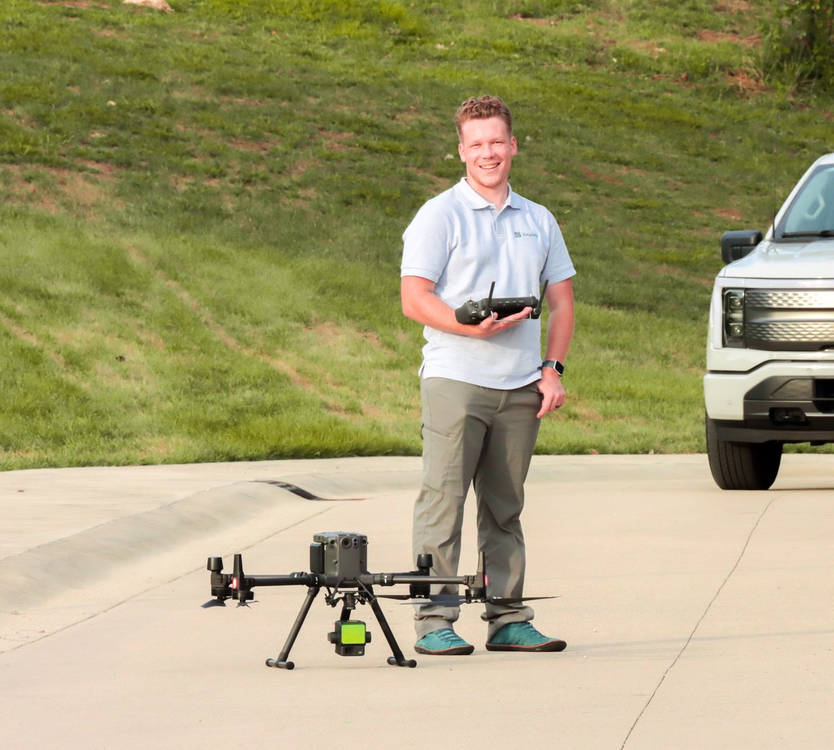 Founder Brenton Roesner with a LiDAR drone beside the SimpliFly truck